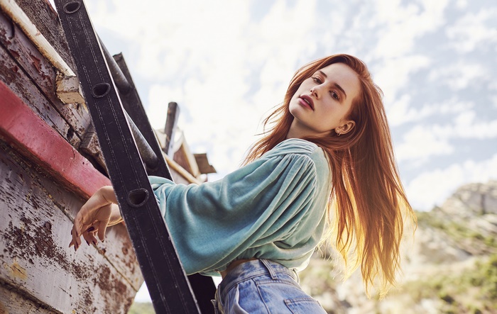 Madelaine Petsch on a ladder