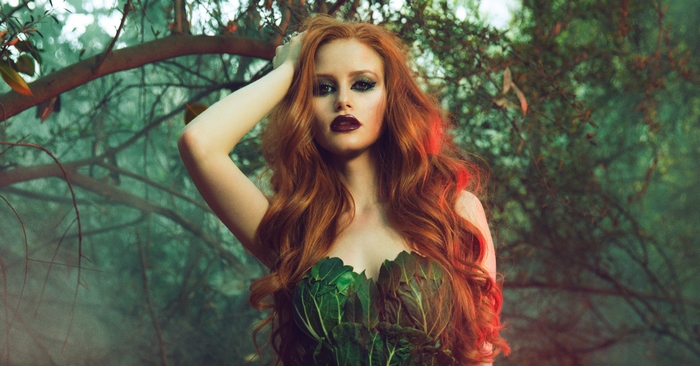 Madelaine Petsch as Poison Ivy in a forest