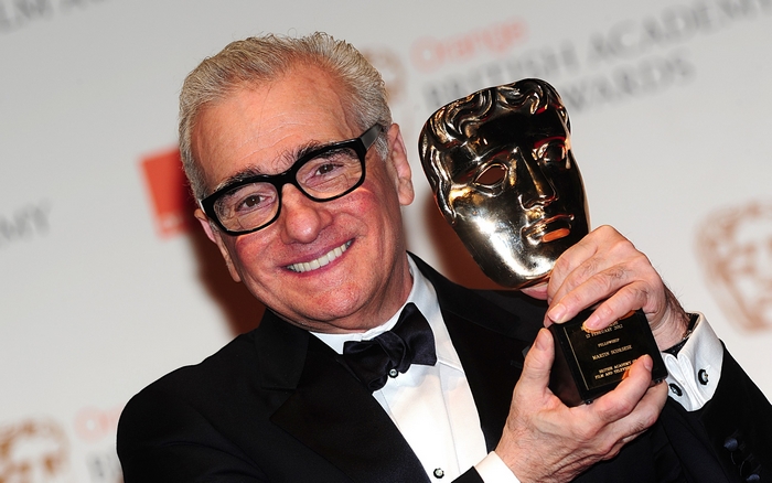 Martin Scorsese holding a BAFTA award