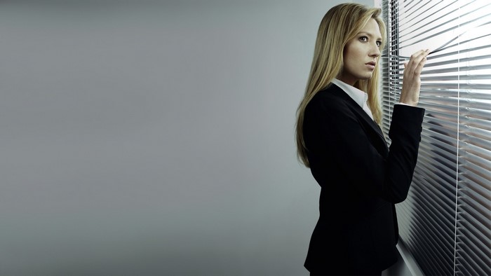 Anna Torv looking through blinds
