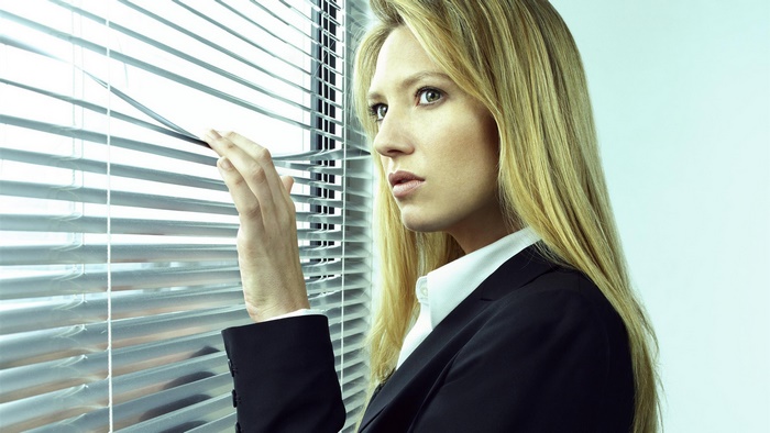Anna Torv looking through blinds