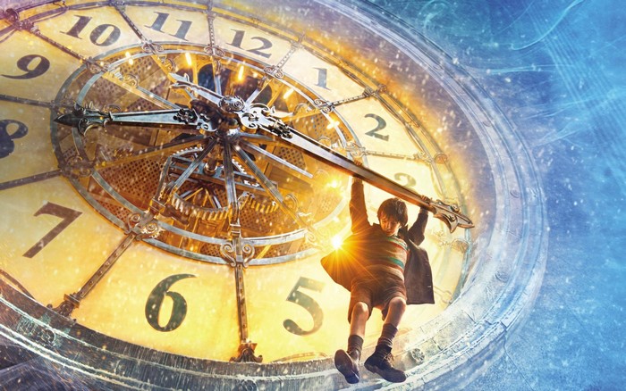 Boy hanging from clock hands