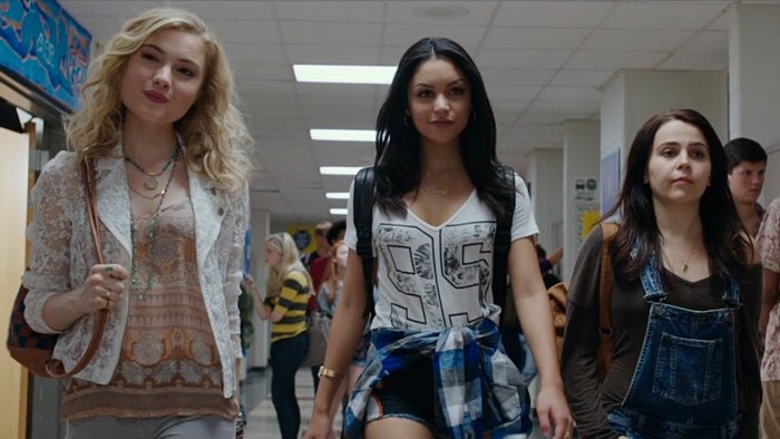 Skyler Samuels and friends in a school hallway