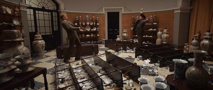Ben Whishaw in a room with broken pottery