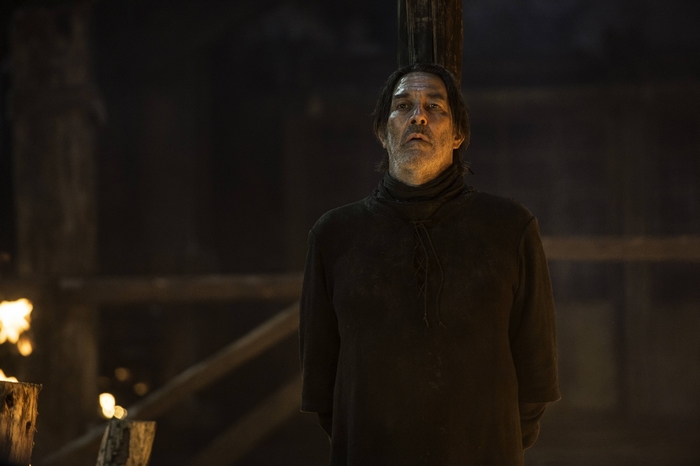 Ciarán Hinds in a dark setting
