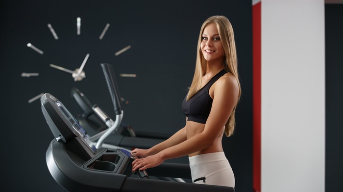Woman on a treadmill in a gym