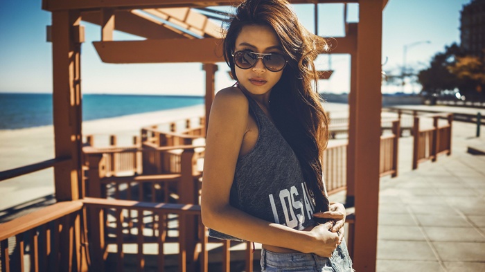 Woman in sunglasses at the beach