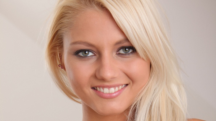 Close-up of a smiling blonde woman