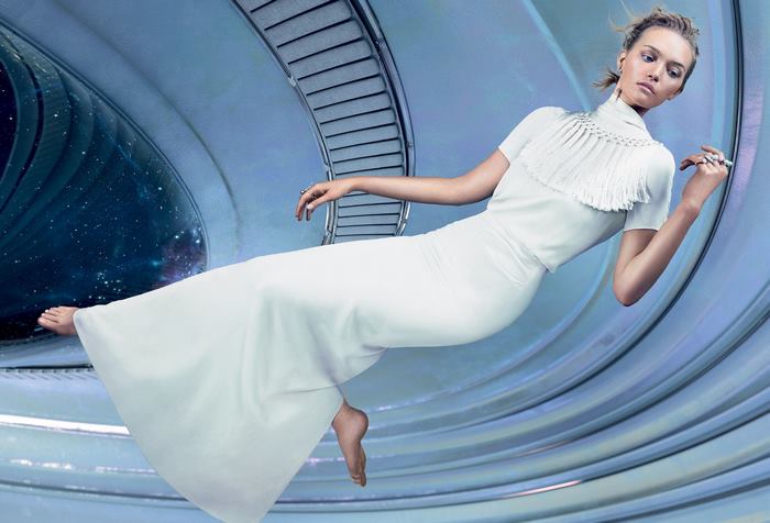 Gemma Ward floating in a futuristic tunnel