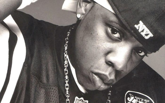 Jay-Z wearing a New York Jets jersey