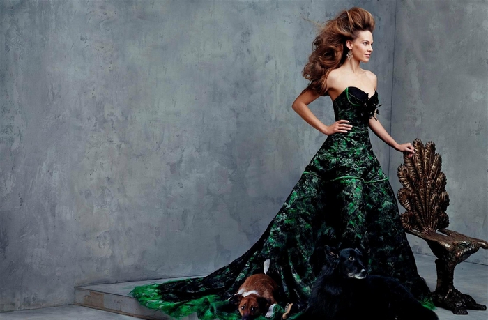 Hilary Swank in a green dress with animals