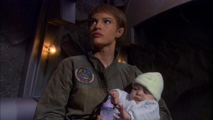 T'Pol from Star Trek holding a baby