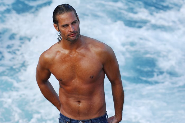 Josh Holloway shirtless in front of water