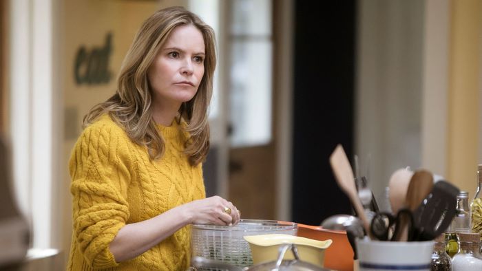 Jennifer Jason Leigh in a yellow sweater
