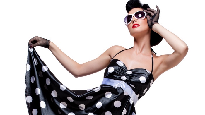 Woman in polka dot dress and sunglasses