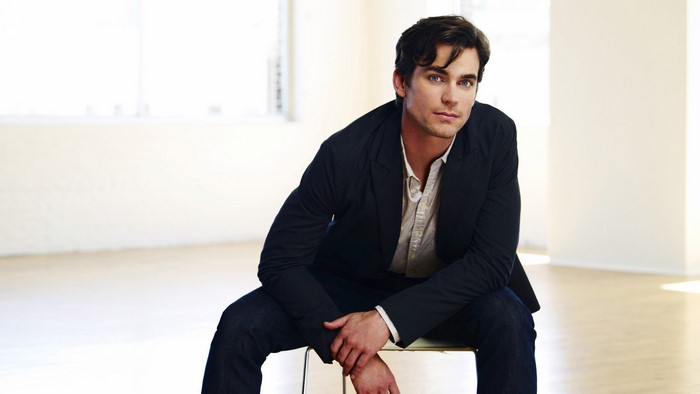 Matt Bomer sitting in a studio