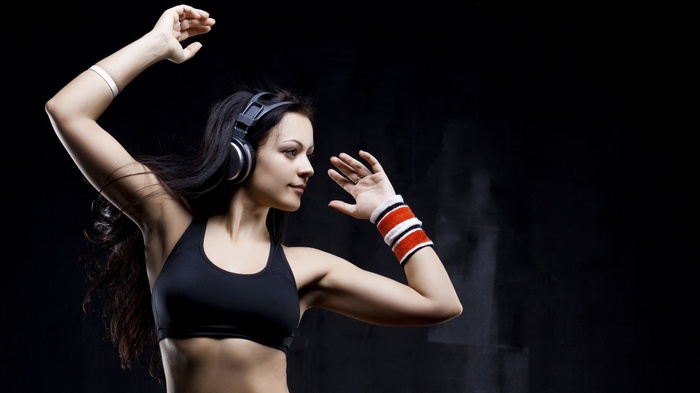 Woman with headphones dancing