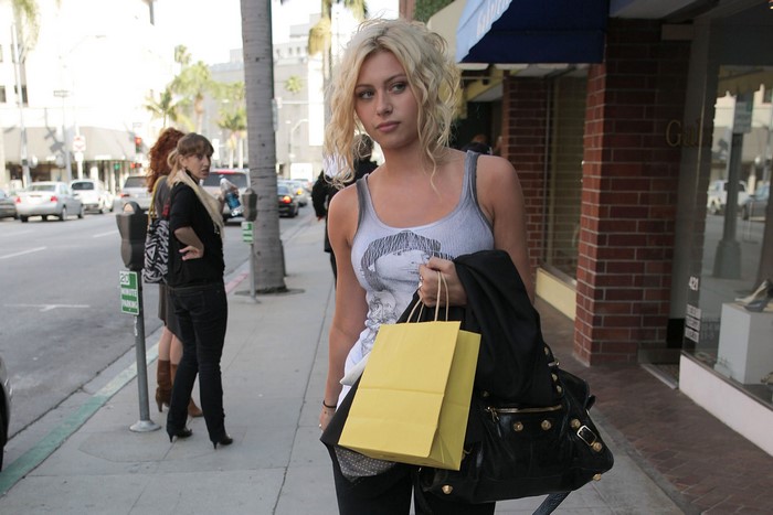 Aly Michalka shopping on a street