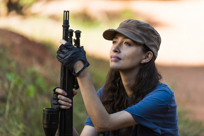 Christian Serratos with a rifle