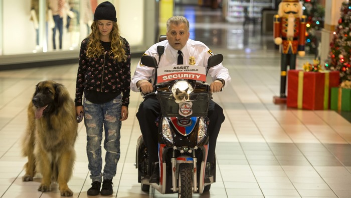 Security guard on scooter with cat, girl with dog