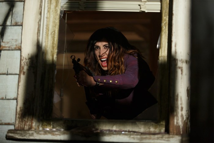 Dana DeLorenzo with a gun