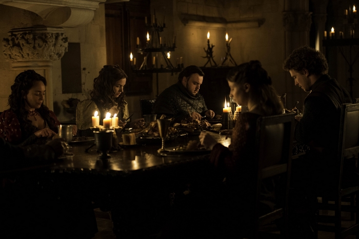 Hannah Murray and others at a dinner table
