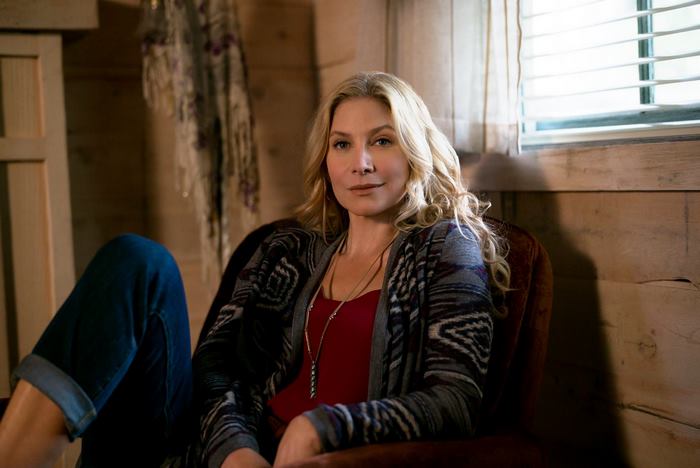 Elizabeth Mitchell sitting in a chair