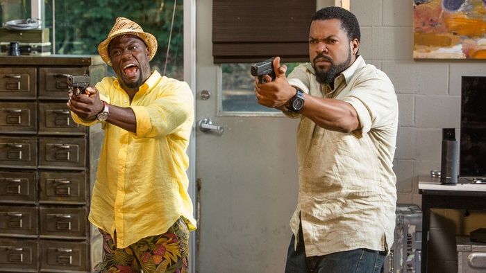 Ice Cube and Kevin Hart with guns