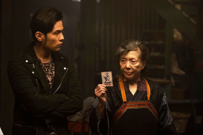 Jay Chou holding a card