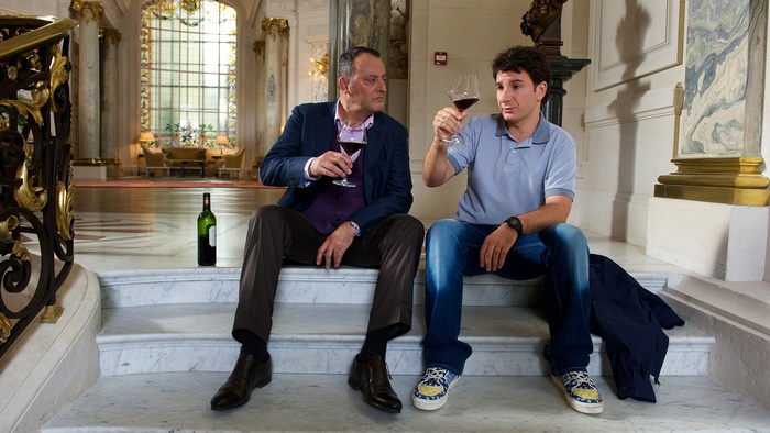 Jean Reno and man drinking wine
