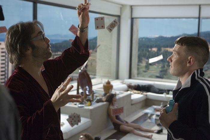 Joel Edgerton performing magic trick with cards