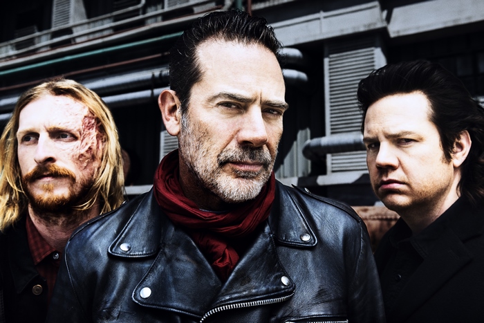Negan and two men from The Walking Dead