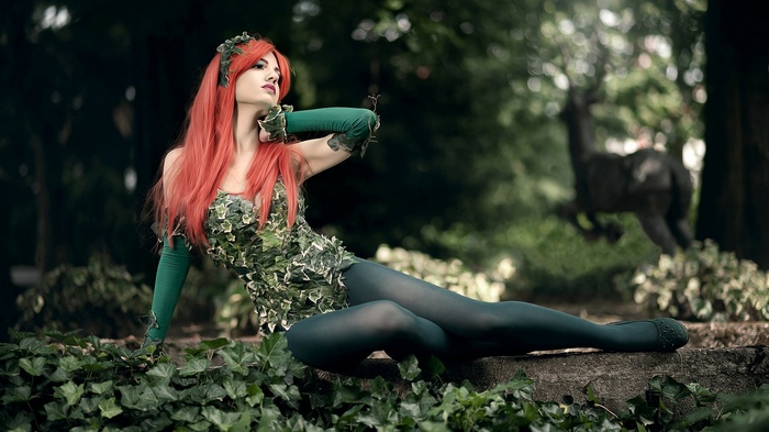 Poison Ivy from Batman posing in a forest