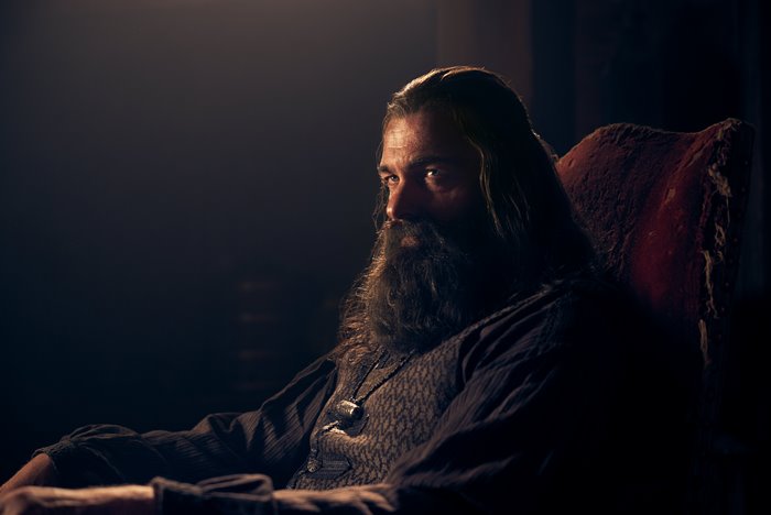 Ray Stevenson in a chair