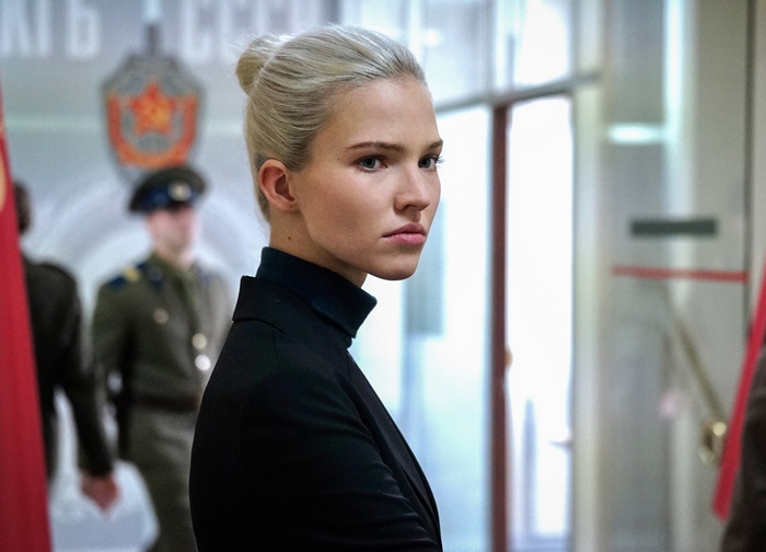 Sasha Luss in a black turtleneck