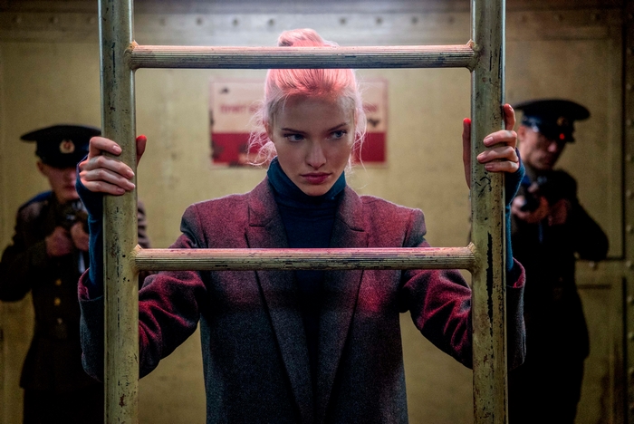 Sasha Luss in a dark, gritty setting