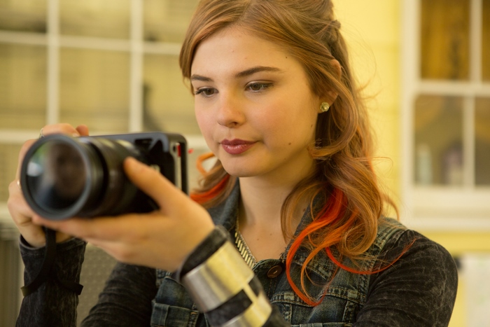 Stefanie Scott holding a camera