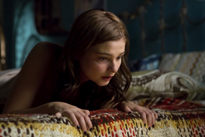 Stefanie Scott on a bed