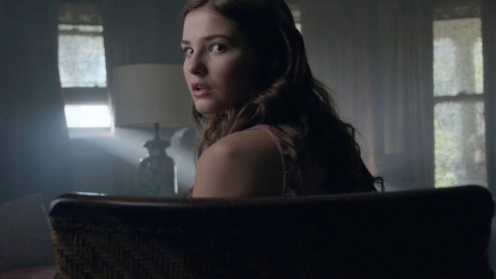 Stefanie Scott in a dimly lit room