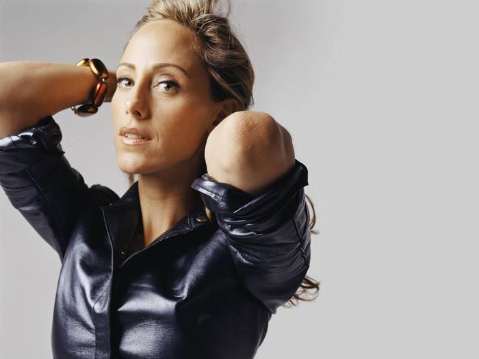 Kim Raver in a black leather jacket