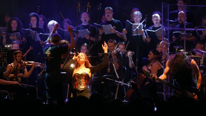 Simone Simons performing with a choir and orchestra