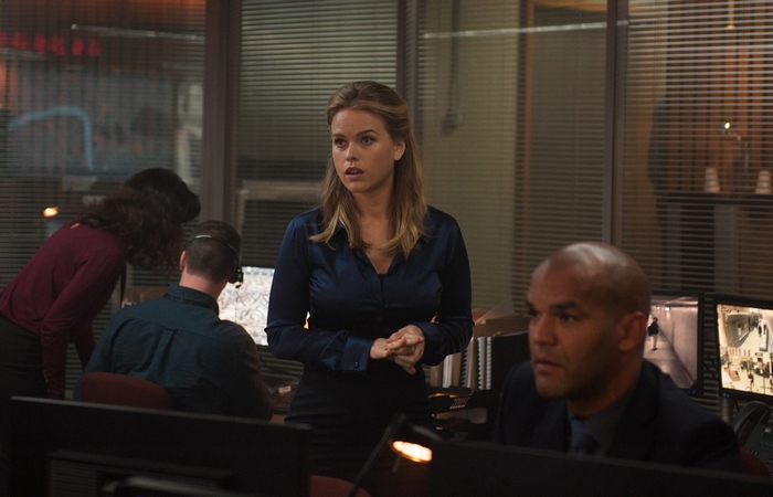 Alice Eve in a dark blue shirt