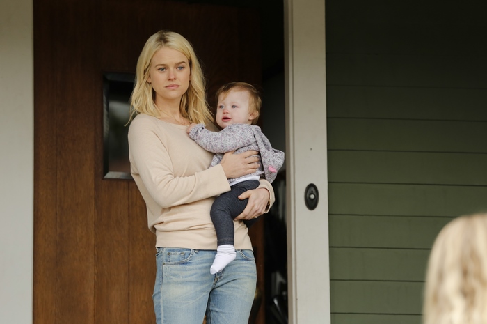 Alice Eve holding a baby