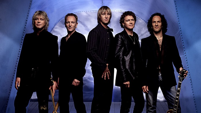 Def Leppard band members posing