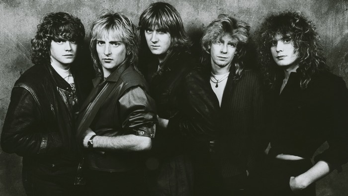 Def Leppard band members posing