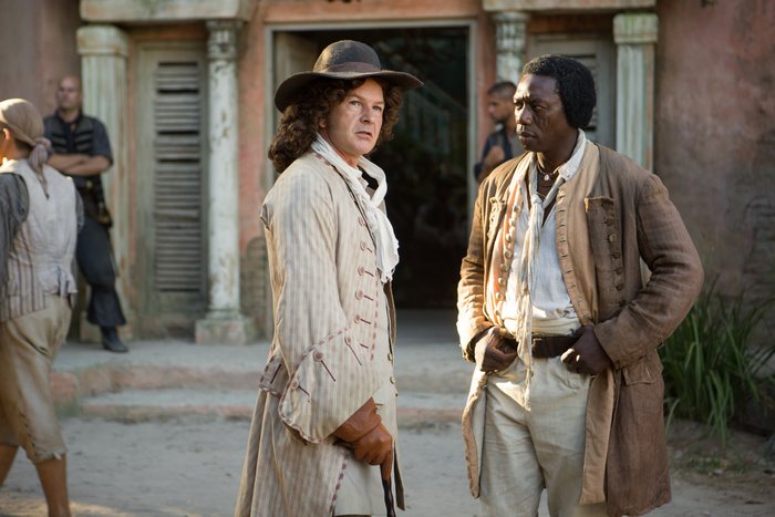 Two men in historical costumes talking outdoors