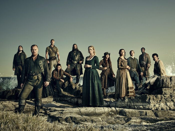 Black Sails Cast Posed on Rocks by the Sea