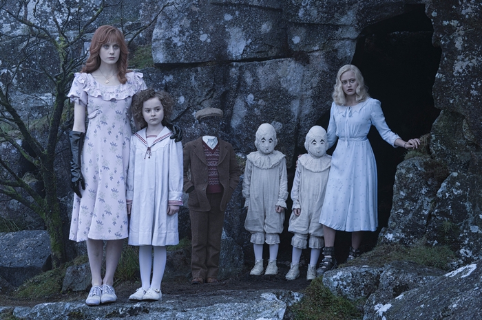 Ella Purnell and children in a cave