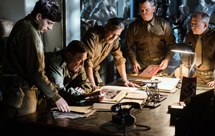 Men in military uniforms examining documents
