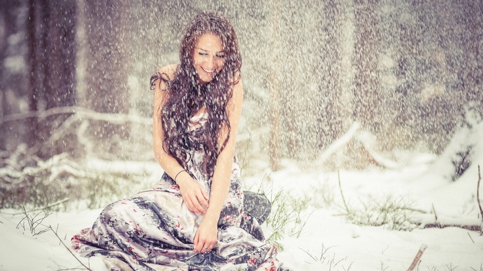 Woman in a dress in the snow